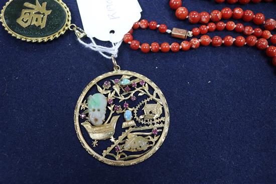 A Chinese 18ct gold and multi gem set pierced circular pendant, one other pendant and two items of coral.